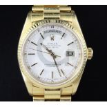 A gentlemen's 18ct yellow gold Rolex Oyster Perpetual Day Date wrist watch, with white dial, baton