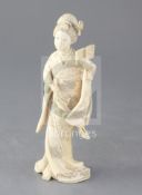 A Japanese ivory figure of a bijin, Meiji period, the figure holding a book and a bunch of