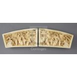 A pair of Chinese ivory wrist rests, 19th century, carved in mirror image with a sage and boys in