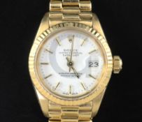 A lady's 18ct gold Rolex Oyster Perpetual Datejust wrist watch, with white dial, baton numerals