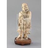 A Chinese carved soapstone figure of Li Tieguai, 18th century, holding a staff, inset into a