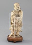A Chinese carved soapstone figure of Li Tieguai, 18th century, holding a staff, inset into a