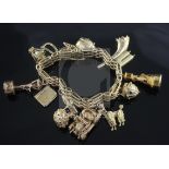 A Russian 56 zolotnik gold charm bracelet, hung with thirteen assorted mainly 9ct gold charms,