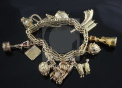 A Russian 56 zolotnik gold charm bracelet, hung with thirteen assorted mainly 9ct gold charms,