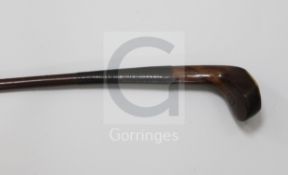 An early 20th century mahogany Sunday stick, the head with lead back weight and bone plate to the