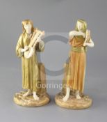 A pair of Royal Worcester Egyptian musicians by James Hadley, c.1891, model number 1084, height 22.