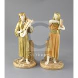 A pair of Royal Worcester Egyptian musicians by James Hadley, c.1891, model number 1084, height 22.