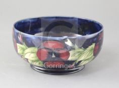 A Moorcroft pansy pattern bowl, diameter 8.25in.