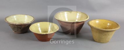 Four 19th century terracotta cream pans, with glazed interiors