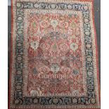 A Ziegler carpet, the madder field with a trellis bearing ivory flowerheads, floral sprays and