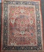 A Ziegler carpet, the madder field with a trellis bearing ivory flowerheads, floral sprays and