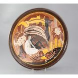 A Longwy Pottery 'Les Bagneuses' wall charger, enamelled with bathers beside a river, resting on the