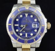 A gentlemen's stainless steel and yellow gold Rolex Oyster Perpetual Date Submariner wrist watch,