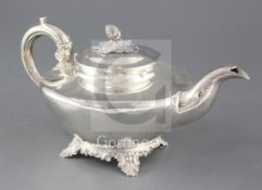 A William IV silver pear shaped teapot by Pearce & Burrows, of squat form, with pineapple finial, on