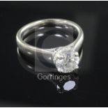 A modern 14ct white gold and solitaire diamond ring, (jeweller's certification, 1.14cts, J colour,