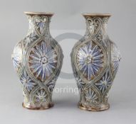 A pair of Doulton Lambeth baluster vases, decorated by Frank Butler, with stylised floral motifs,