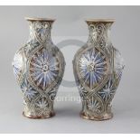 A pair of Doulton Lambeth baluster vases, decorated by Frank Butler, with stylised floral motifs,