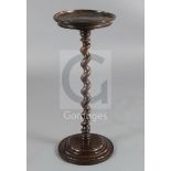 A 17th century fruitwood candle stand on spiral-turned column, H.2ft 3in. Diam. 11in. (some