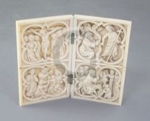 A 19th century French gothic revival ivory diptych, carved with scenes of The Adoration, The Road to