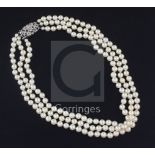 A triple strand cultured pearl choker necklace with 9ct white gold and diamond cluster clasp, in