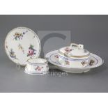 A group of Sevres table wares, c.1769-1774, each painted with floral sprays within blue line and