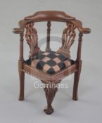 Denis Hillman. A George II style carved mahogany miniature corner armchair, with pierced twin