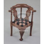 Denis Hillman. A George II style carved mahogany miniature corner armchair, with pierced twin