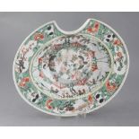 A Chinese export famille verte oval barber's bowl, Kangxi period, painted with birds amid flowers