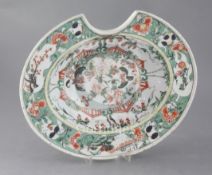 A Chinese export famille verte oval barber's bowl, Kangxi period, painted with birds amid flowers