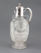 A late Victorian silver mounted cut glass claret jug by Mappin Brothers, of ovoid form, on cusped