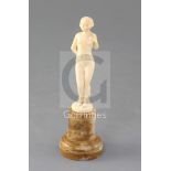 Joe Descamps. A 1930's carved ivory figure of a nude, signed, height 5.75in.