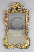 A George II carved and gilt frame looking glass, with rectangular shaped plate in a pierced scroll