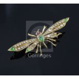 An early 20th century gold, demantoid garnet and seed pearl set bug brooch, with garnet? set eyes,