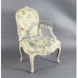 A set of four mid 18th century Louis XV painted fauteuils, with flower carved moulded frames,