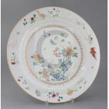 A Chinese famille rose charger, Qianlong period painted with a crane, other birds, fence, rockwork