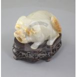 An unusual Chinese pale celadon and russet skin jade 'lion-dog' snuff bottle, 19th century, the