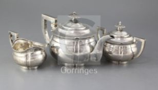 A late 19th/early 20th century Chinese Export silver three piece tea set by Zee Wo, Shanghai, of