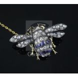 An Edwardian gold and silver, sapphire and diamond bee brooch, with cabochon set eyes, 35mm.