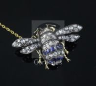 An Edwardian gold and silver, sapphire and diamond bee brooch, with cabochon set eyes, 35mm.