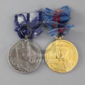 Two Delhi Durbar medals; 1903 in silver and 1911 in gold, mounted on a bar with distressed ribbons