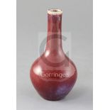 A Chinese flambe bottle vase, 18th/19th century, the rim and lower third of the vase with purple,