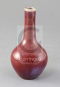 A Chinese flambe bottle vase, 18th/19th century, the rim and lower third of the vase with purple,