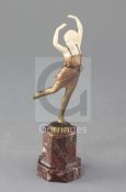 An Art Deco ivory and cold patinated bronze figure of a dancing girl, raised on hardstone plinth