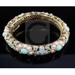 An Indian gold, split pearl and turquoise set hinged bangle.