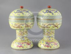 A pair of Chinese yellow ground altar vessels and covers, dou, iron red Daoguang seal marks and of