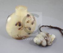 A Chinese pale celadon and brown jade carving and a shadow agate snuff bottle, late 19th/early