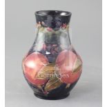 A Moorcroft pomegranate pattern baluster vase, height 6.75in.