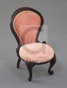 Denis Hillman. A Victorian style mahogany miniature balloon-back nursing chair, with pink velvet