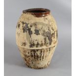 A 19th century, probably French, earthenware storage jar, with unglazed body and a two handled