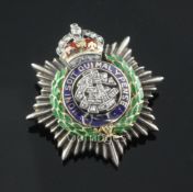An 18ct gold, diamond and three colour enamel Army Service Corps sweethearts brooch, 33mm.